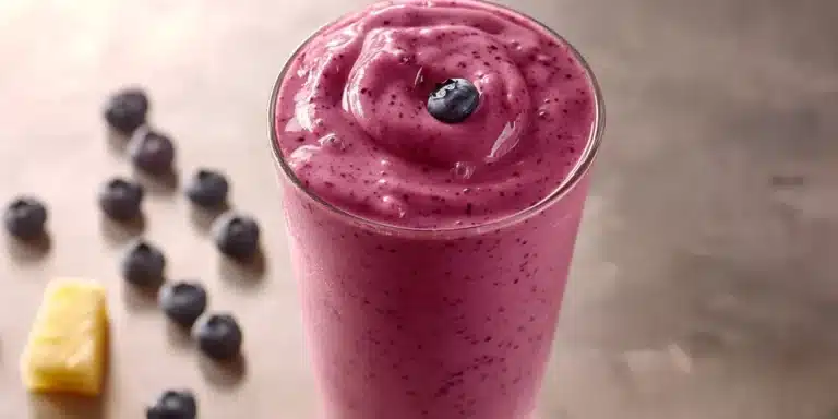 Close-up of an antioxidant-rich blueberry pineapple smoothie.